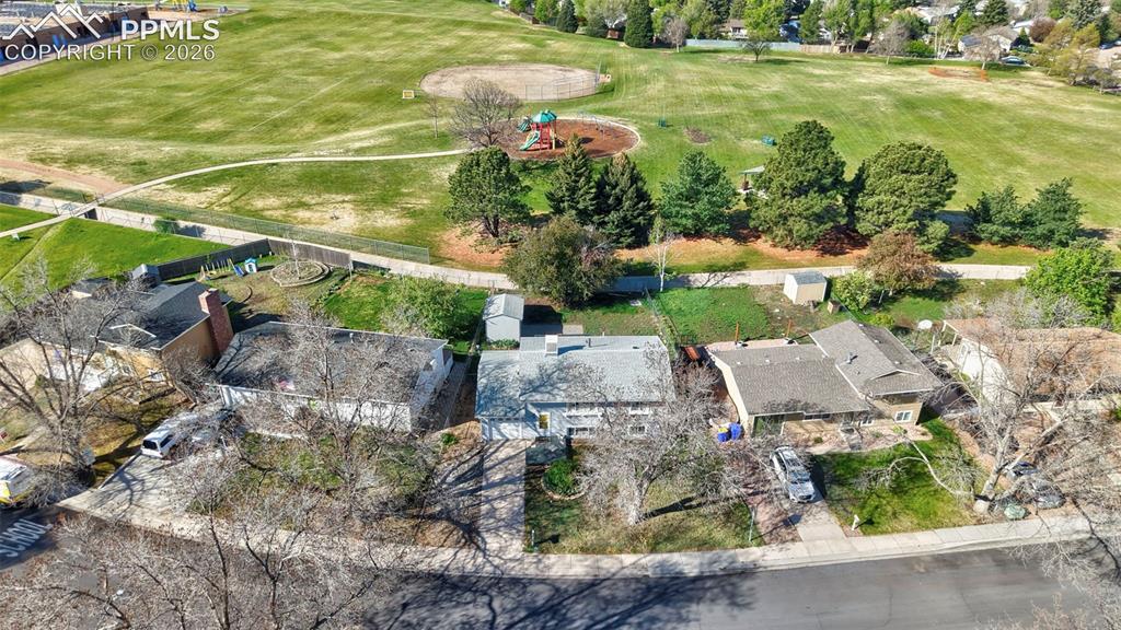 Image 35 of 41: Aerial View of home and open space behind