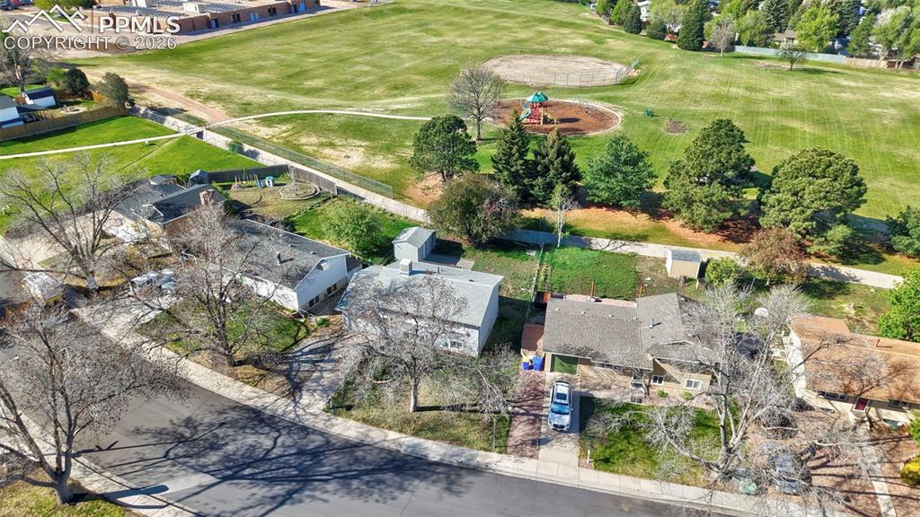 Image 36 of 41: Aerial View of home and open space behind