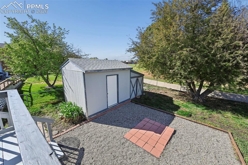 Image 7 of 41: Storage Shed in the Back Yard