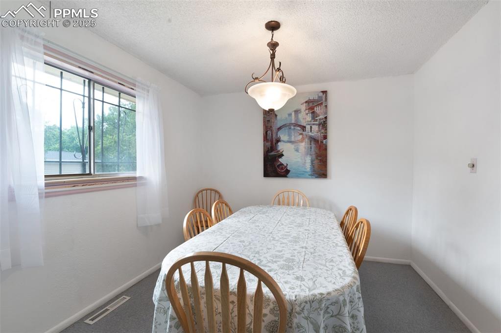 Image 10 of 50: Very Spacious Dining Room