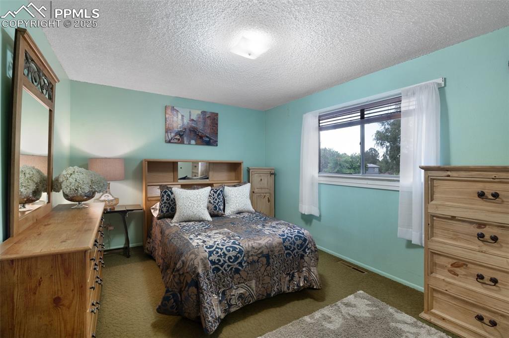Image 12 of 50: Primary Bedroom In Main House