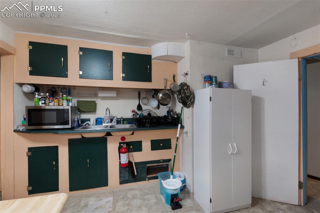 Image 30 of 50: Another View Of Basement Kitchen