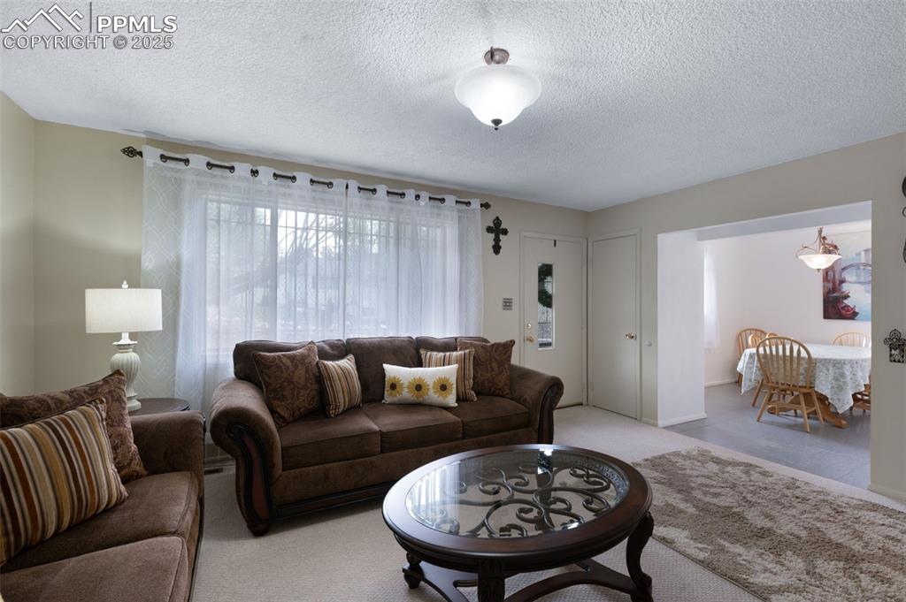 Image 8 of 50: Living Room Opens To Dining Room