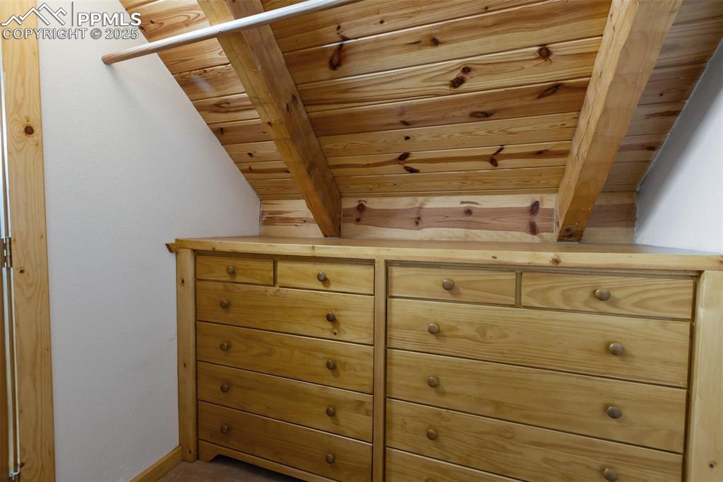 Image 23 of 46: Primary closet includes built-in dresser