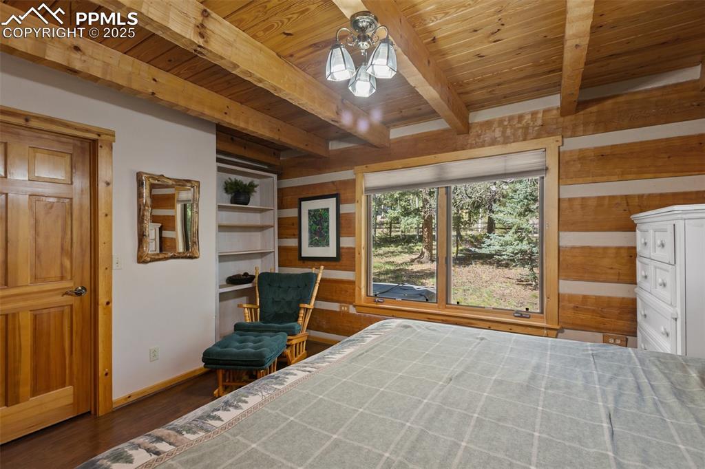 Image 24 of 46: Bedroom #2 on the main level, includes walk-in closet and could double as t