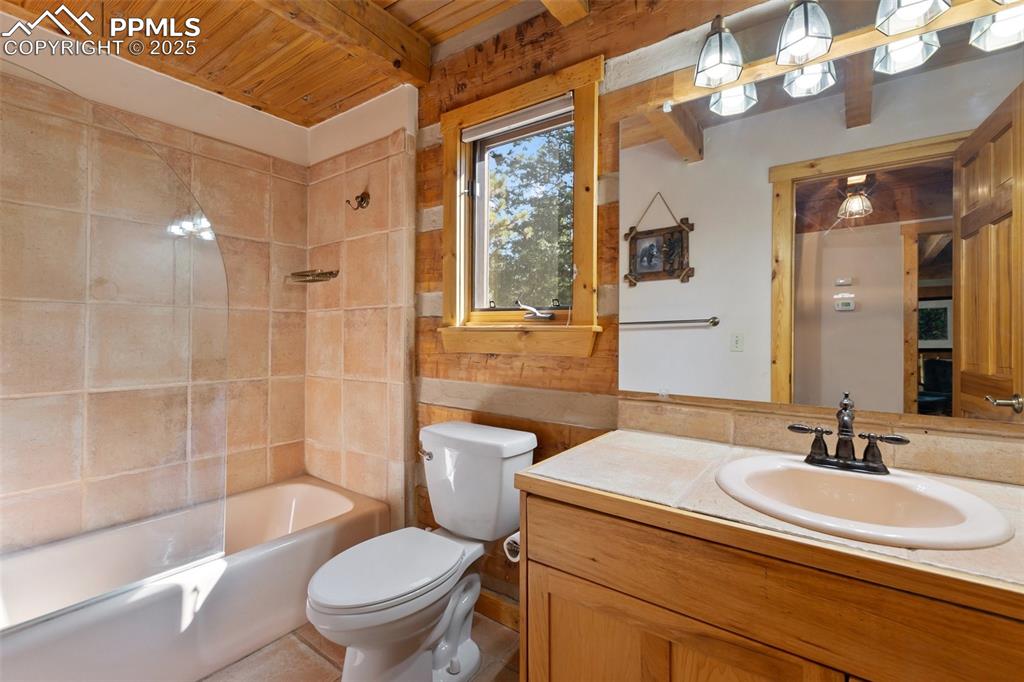 Image 28 of 46: This bathroom is on the main level and serves the guest bedroom or could be