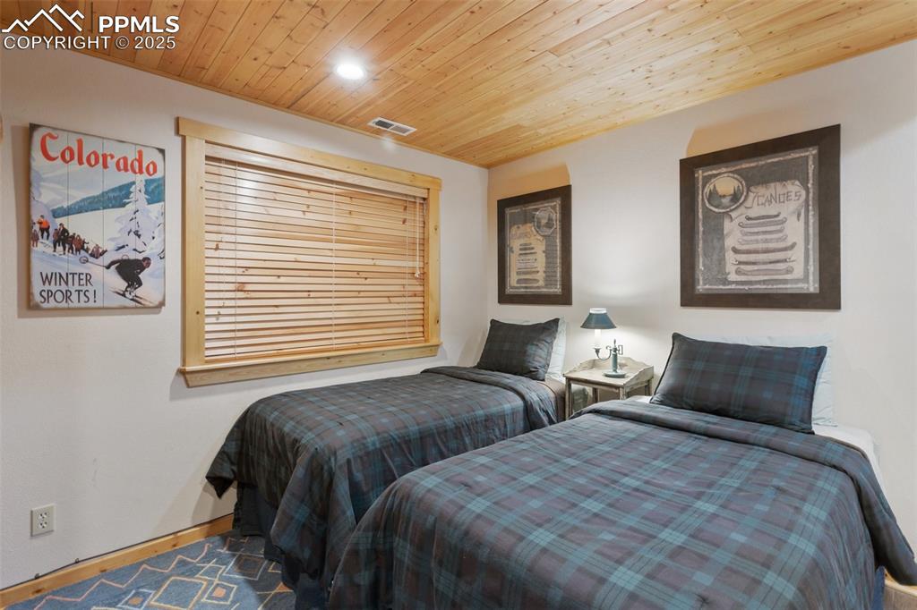 Image 29 of 46: Family room currently used as extra guest quarters.