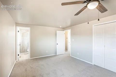 Image 10 of 26: Carpeted Master room with neutral-toned walls