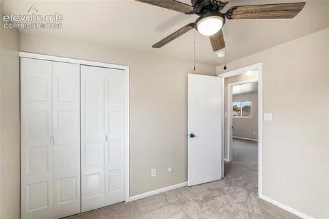 Image 16 of 26: 3rd upper Bedroom featuring neutral wall paint, grey carpet flooring, and a