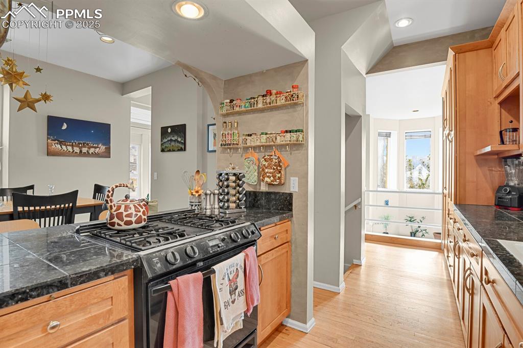 Image 10 of 34: Looking from the kitchen to the dining room area