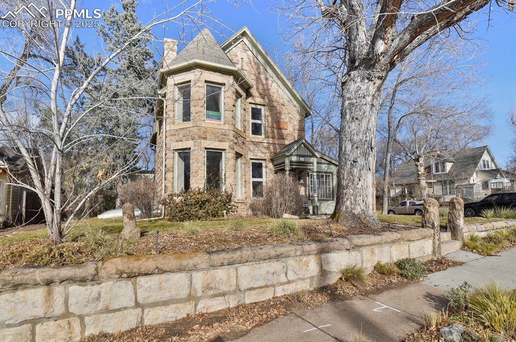 Image 2 of 34: Beautiful original stone house constructed in 1895 with a beautiful turret