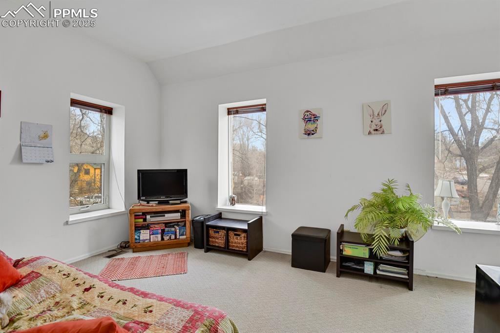 Image 25 of 34: One of the upper level bedrooms