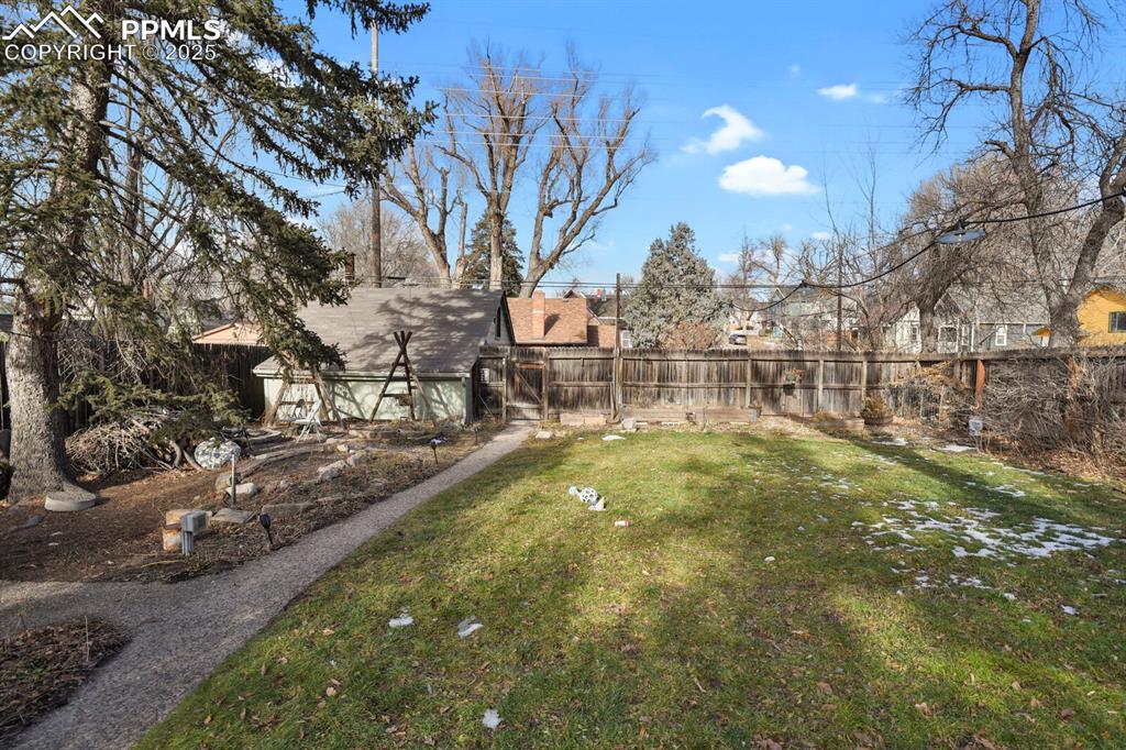 Image 30 of 34: Walk-way to two car deatched garage