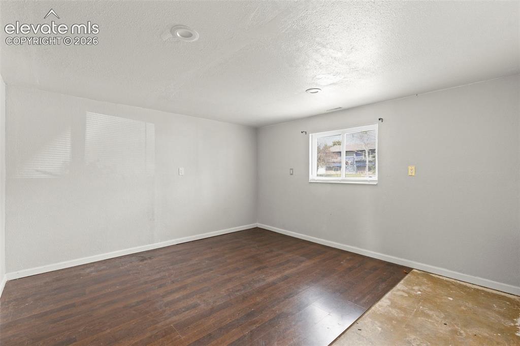 Image 21 of 24: Room featuring recessed lighting, a white-framed window, and wood-finish fl