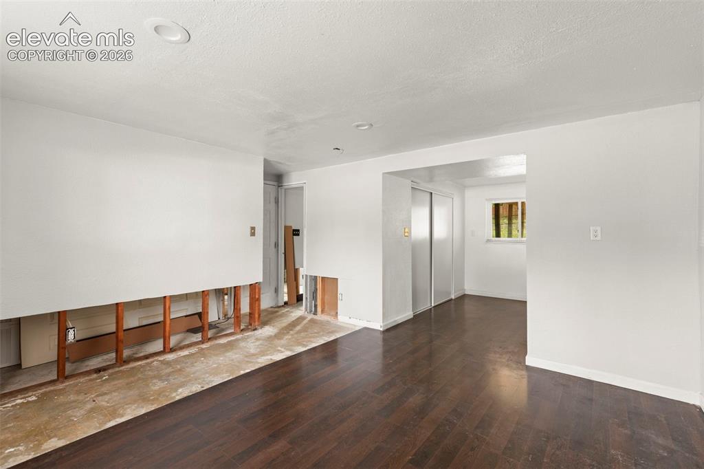 Image 22 of 24: Dark wood-finish flooring