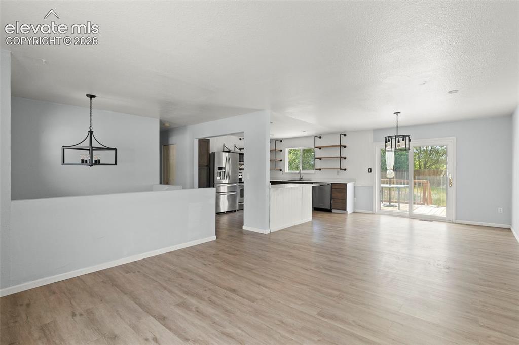Image 4 of 24: Spacious living room and dining area