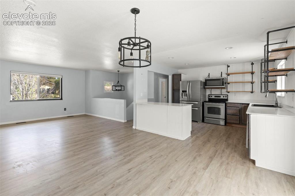 Image 7 of 24: kitchen area and open concept main level