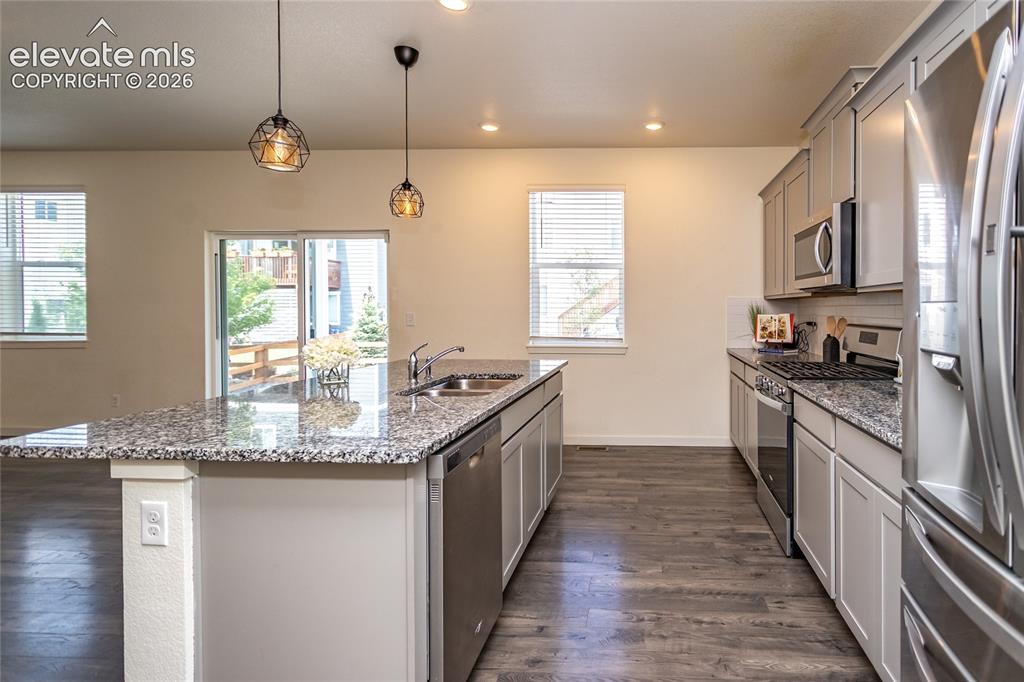 Image 14 of 48: There is ample cabinet and counter space in the kitchen.