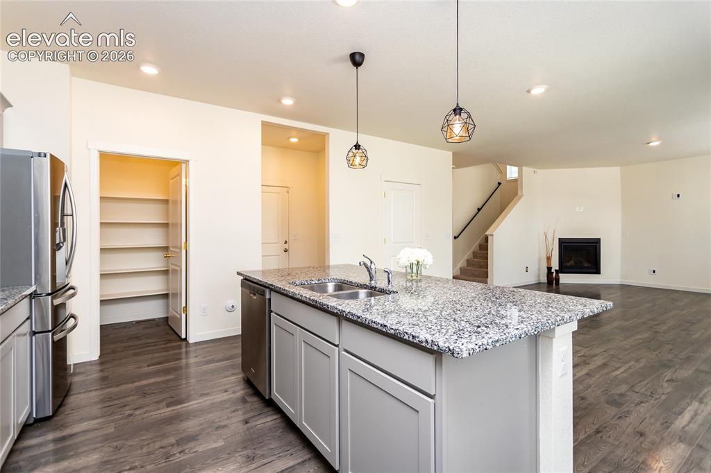 Image 15 of 48: Walk-in pantry is very spacious. There is a large broom/storage closet as w