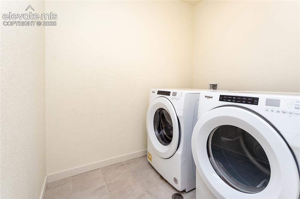 Image 18 of 48: Laundry room is conveniently located on the upper level.