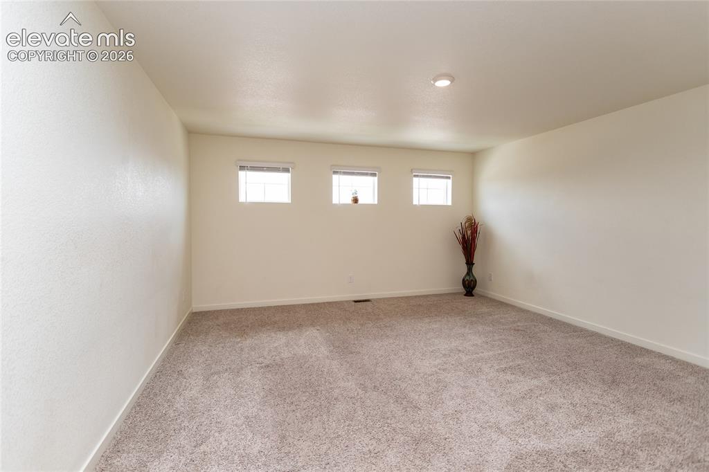 Image 19 of 48: As you go upstairs, you are greeted by a huge loft area offering views of C