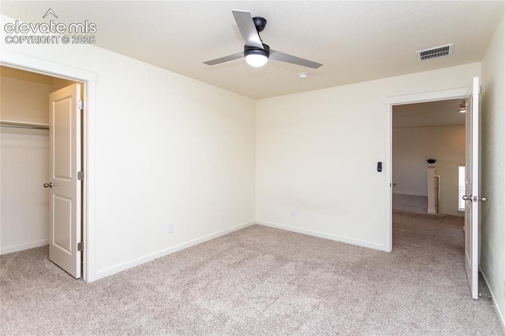 Image 30 of 48: Bedroom 2 with a walk-in closet