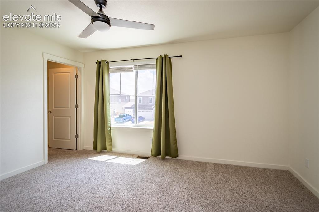 Image 32 of 48: Bedroom 3 on the upper level has beautiful mountain views!