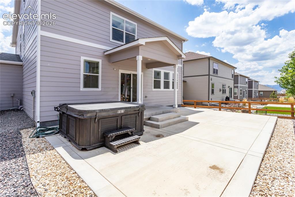 Image 38 of 48: Low maintenance backyard with a relaxing Hot Tub!