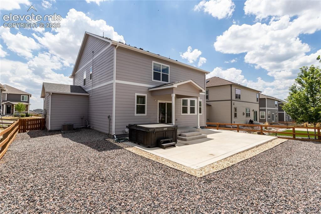 Image 41 of 50: Low maintenance backyard offers many possibilities.