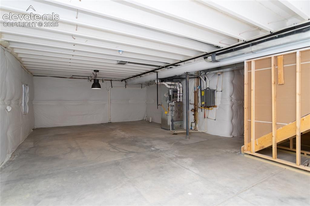 Image 42 of 48: There is a rough-in plumbing for a future bathroom.