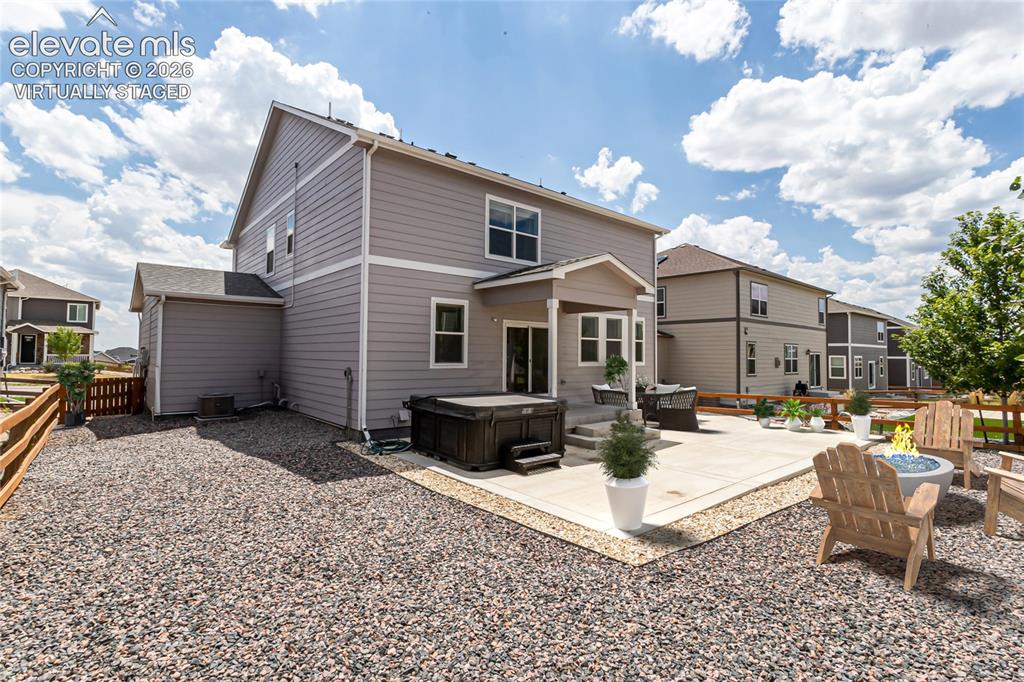 Image 42 of 50: Virtually staged backyard and patio.