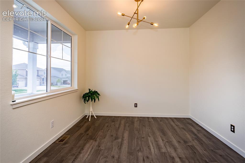 Image 5 of 48: Flex room on the front of the home can be used as an office, play room, for