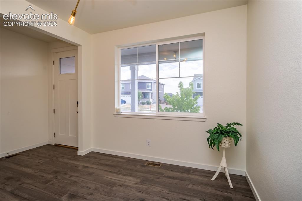 Image 6 of 48: Another view of the flex room and the entry.