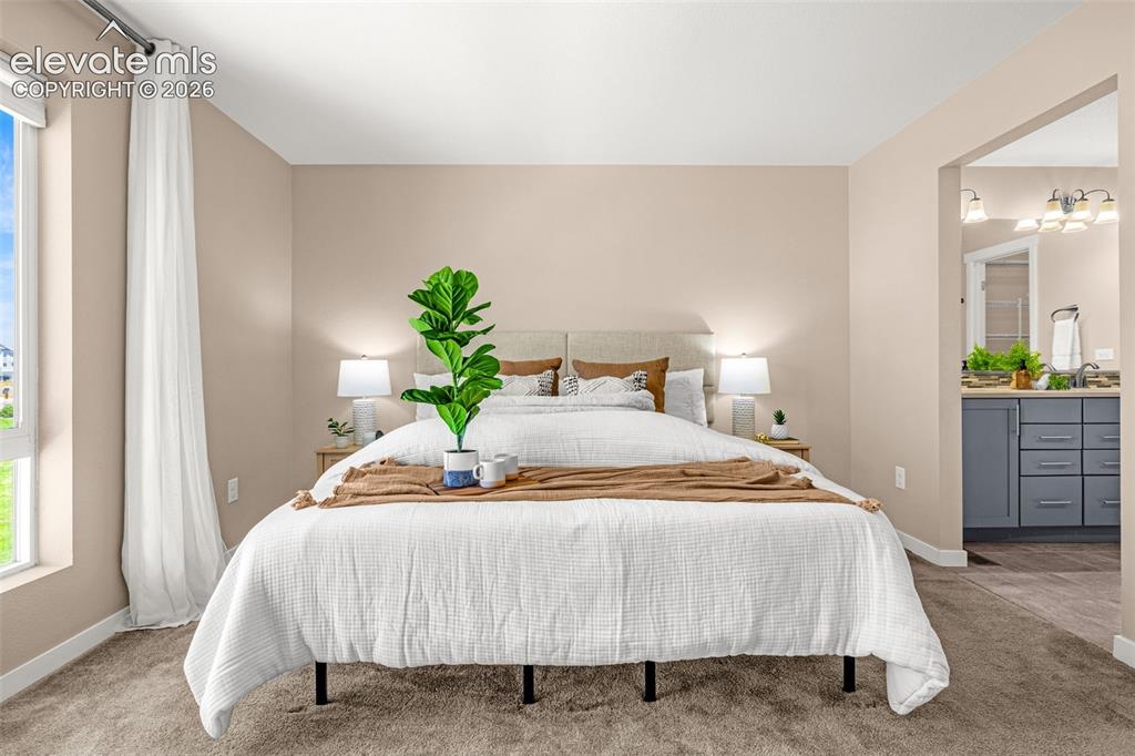 Image 14 of 32: Bedroom featuring neutral wall tones and plush carpeting