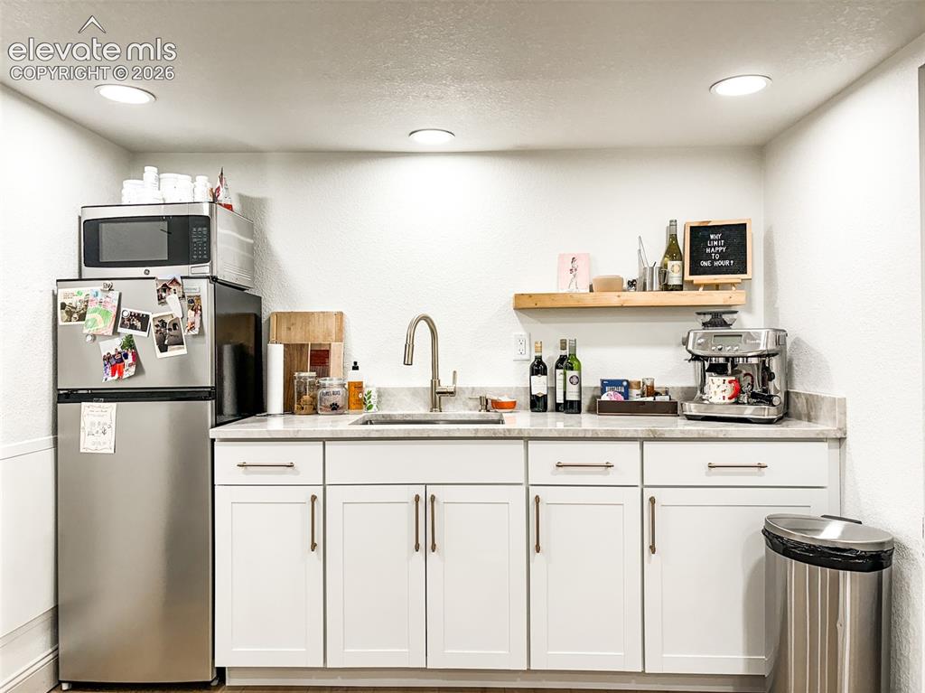 Image 30 of 33: Compact kitchenette in Basement Suite
