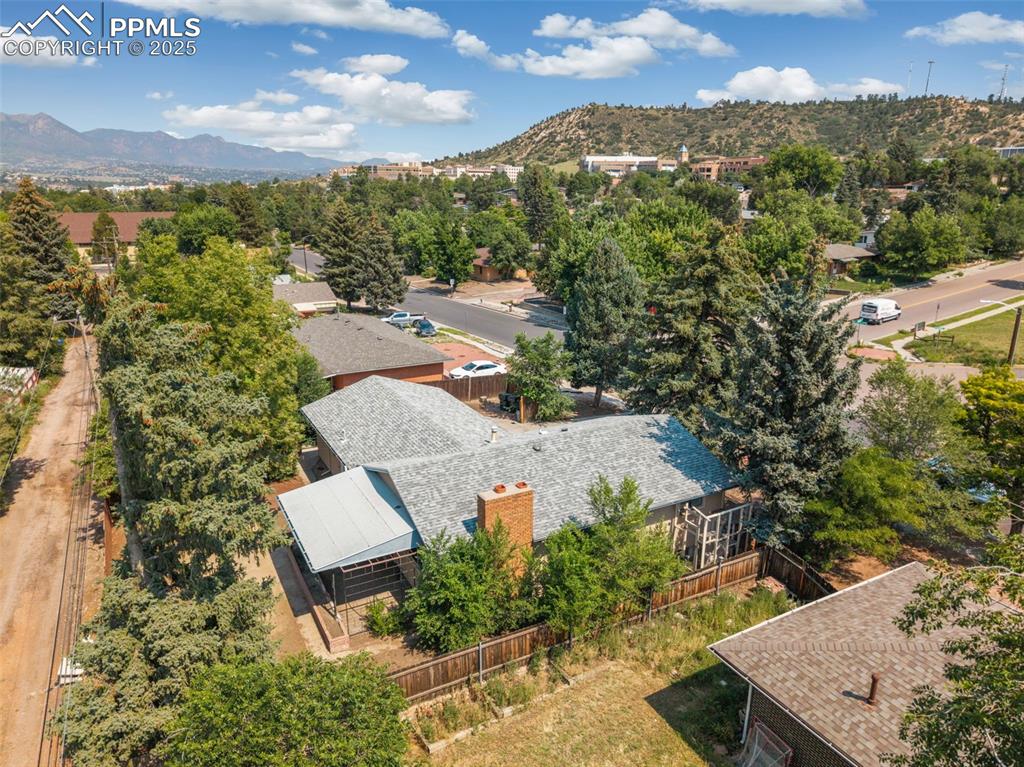 Image 29 of 35: Aerial view of residential area with mountains