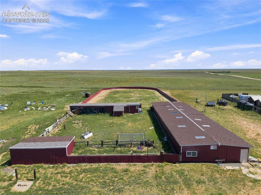 Image 26 of 29: Large horse stable pictured, horse arena/run pictured, chicken coop picture