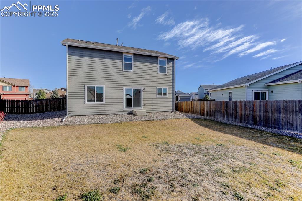 Image 18 of 20: Gated access to backyard