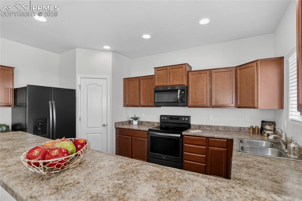 Image 7 of 20: Stone counters & pantry
