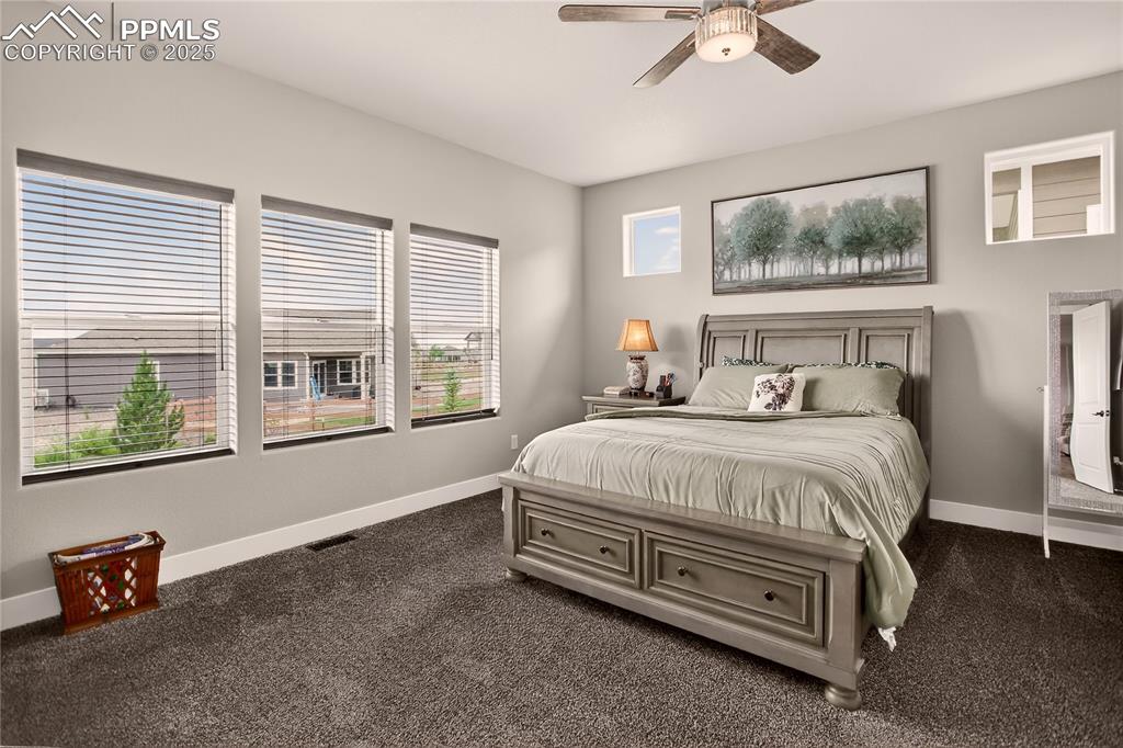 Image 13 of 38: Main level primary suite