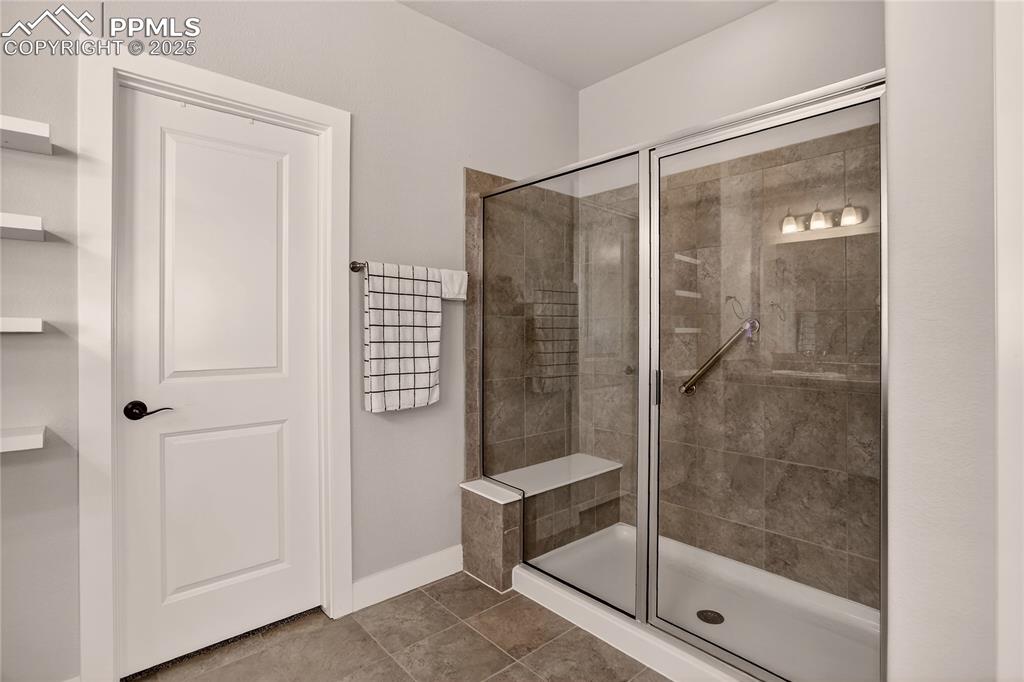 Image 17 of 38: Walk-in standing shower