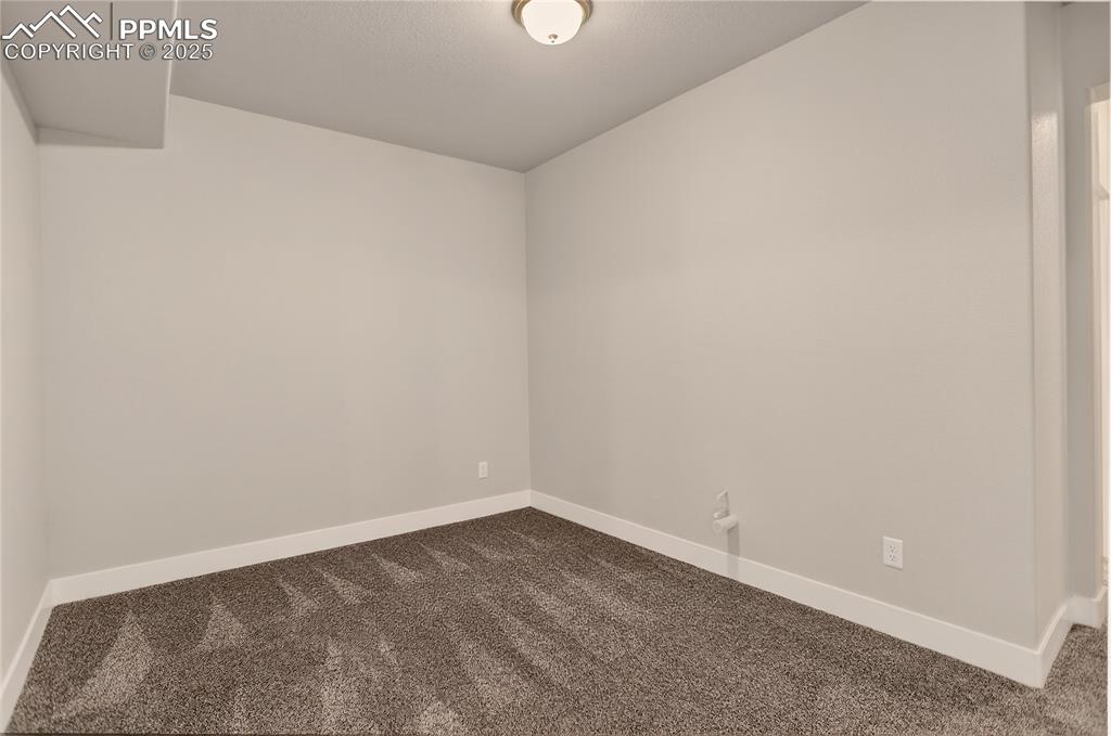 Image 28 of 38: Finished Basement w/ pre-plumb for wet bar