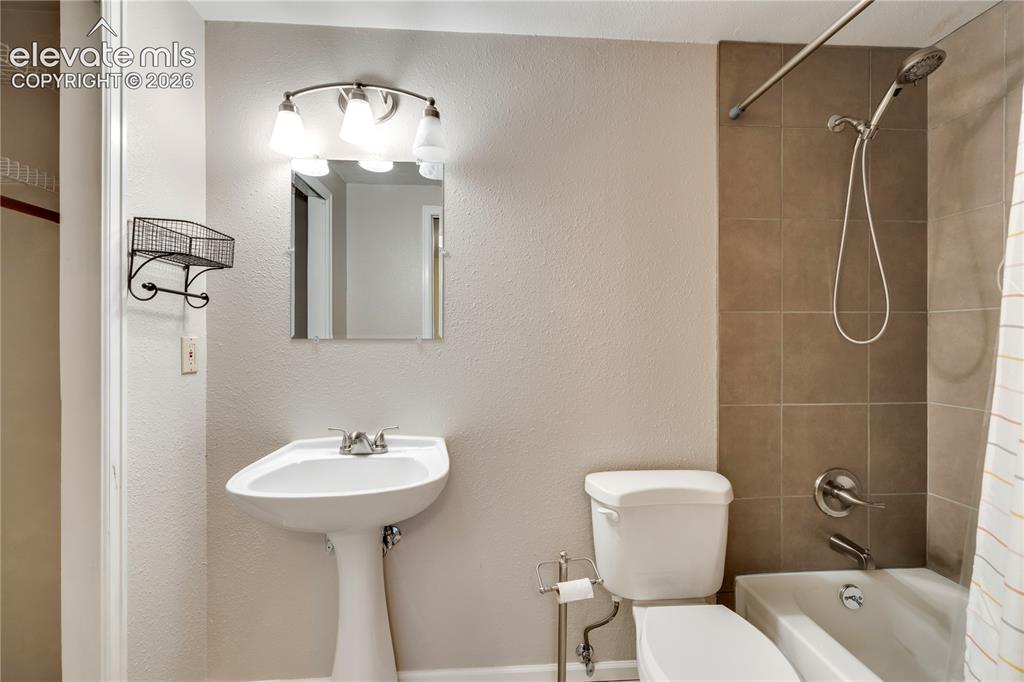 Image 35 of 47: Bedroom #4 in basement has adjoining full bathroom