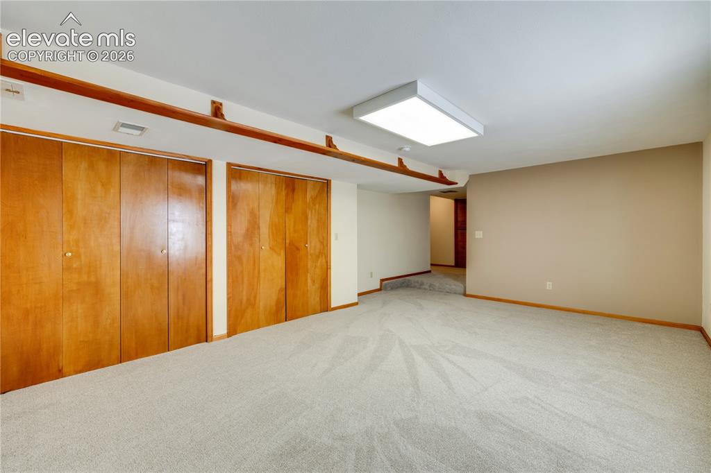 Image 40 of 47: Double closets in basement family room with lots of storage or this large a