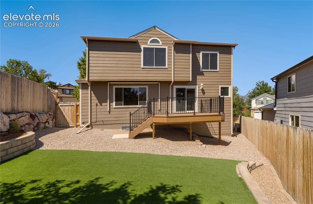 Image 43 of 47: Backyard with view of Rampart Open Space, walk to trails, disc golf course,