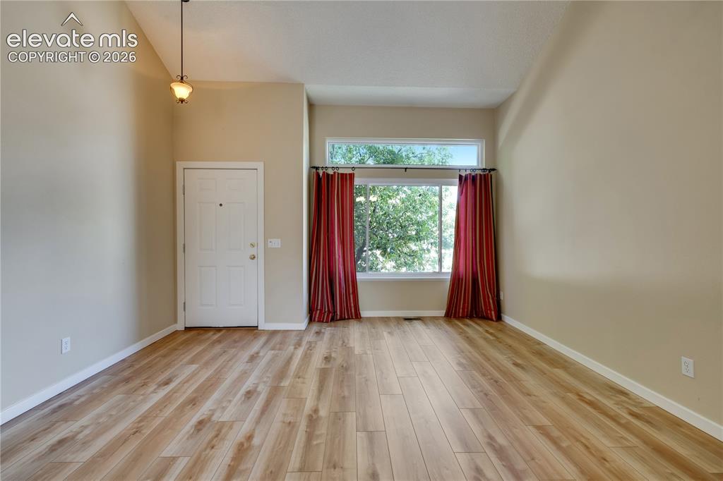 Image 7 of 47: Entry has closet and new luxury vinyl plank flooring