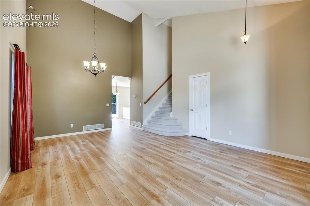 Image 9 of 47: Formal living room has new luxury vinyl plank flooring