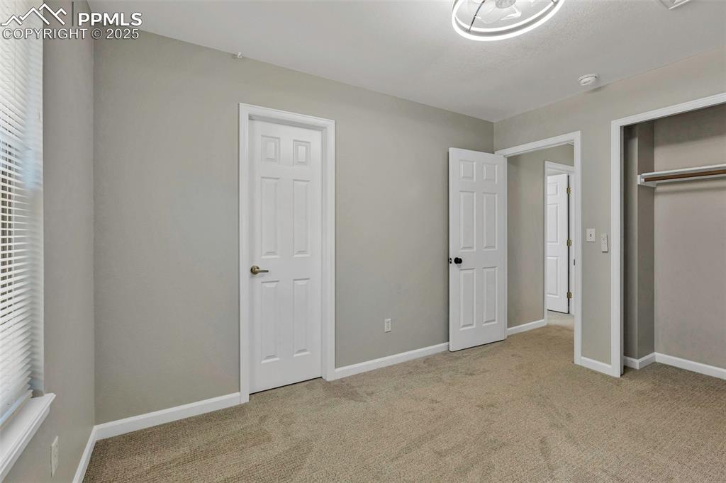 Image 33 of 47: Nice sized bedroom #2 with bathroom access.