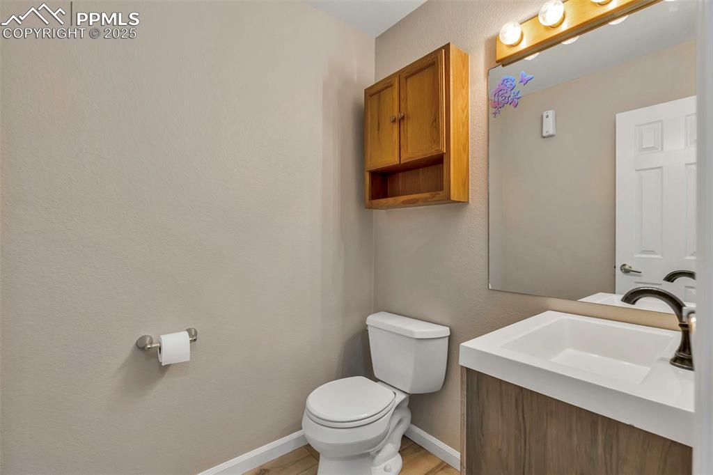 Image 37 of 47: Half bath on main level.