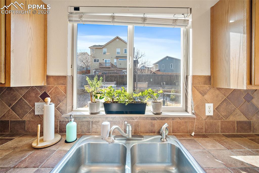 Image 15 of 48: Enjoy a view of your garden and backyard from the kitchen